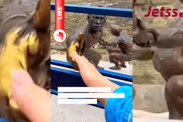 Corrente humana que salvou cachorro vira estátua dez anos depois